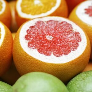 Colorful close-up of juicy citrus fruits including grapefruits, oranges, and limes, perfect for fresh breakfast ideas.