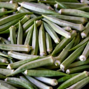 A close-up of fresh organic okra showcasing vibrant green color and natural texture.