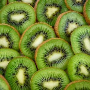 Vibrant, fresh kiwi slices arranged close-up, highlighting their juicy and nutritious appeal.